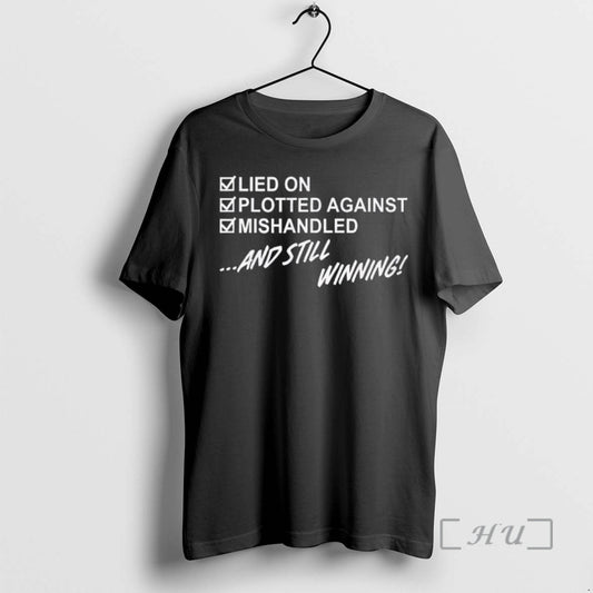 Trending Lied On Plotted Against Mishandled And Still Winning T-Shirts, Hoodie, Sweatshirt | AU18TeeNovaLab.com